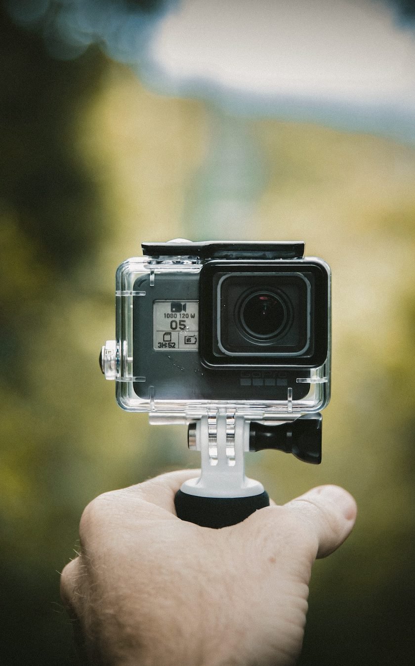 Photograph of a man holding a camera